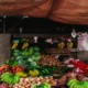 Bahan pokok berupa buah dan sayuran di pasar tradisional.